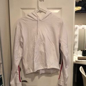 White hoodie with black and red strip on sleeve
